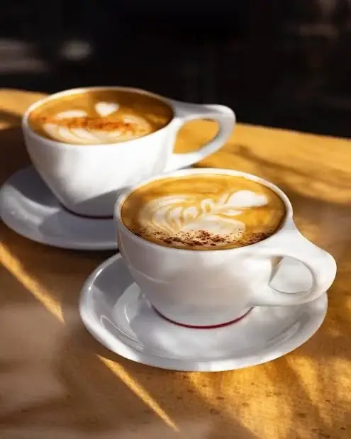 Cider latte and black sesame latte with latte art